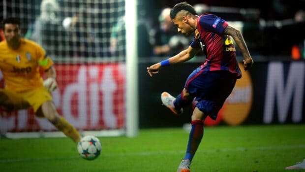 A player is kicking the ball towards goal in a competitive football match featuring goal sports wallpapers, 2K Desktop Wallpaper