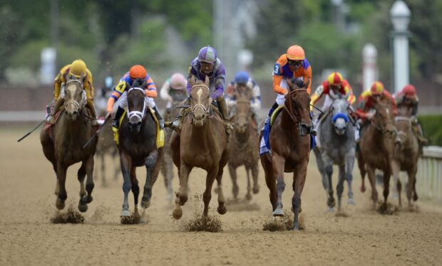 A group of jockeys riding horses fiercely during a horse racing event, HD Desktop Wallpaper