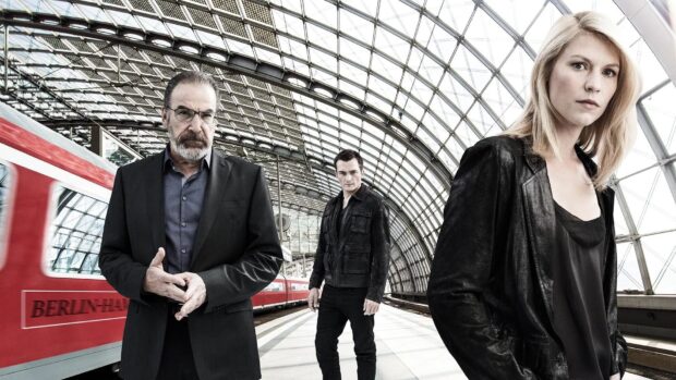 Three serious characters stand inside a modern train station, HD Desktop Wallpaper