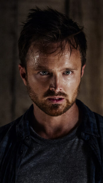The image shows Aaron Paul with sweat on his face in a dramatic moment, 4K Mobile Wallpaper