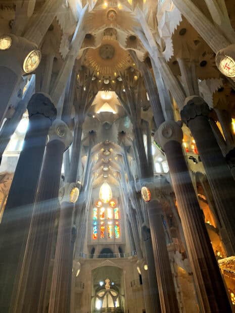 The interior of Sagrada Familia features towering columns and colorful stained glass windows, HD Mobile Wallpaper
