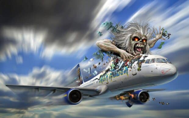 A monstrous figure attacks a plane in Iron Maiden band artwork with dramatic skies, HD Desktop Wallpaper