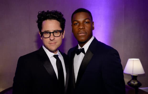 JJ Abrams and a man wearing tuxedos pose at an event with purple lighting, HD Desktop Wallpaper