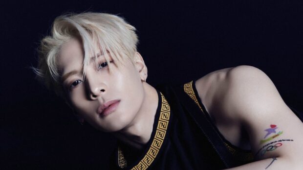A close up portrait of Jackson Wang with blonde hair and a tattoo on his arm, HD Desktop Wallpaper