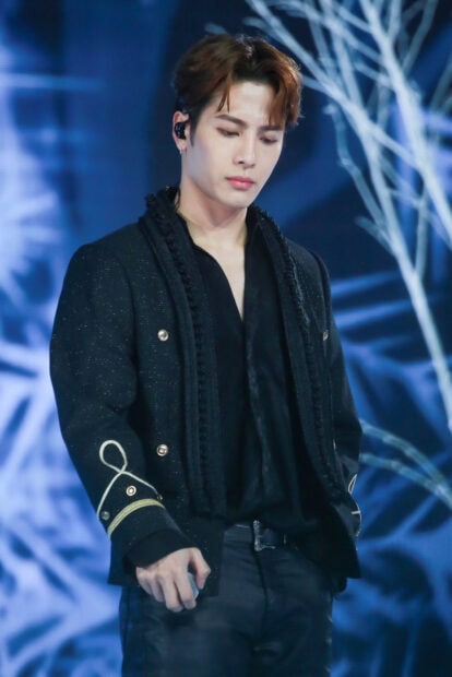 Jackson Wang looks focused during a performance on stage with blue lights, HD Mobile Wallpaper