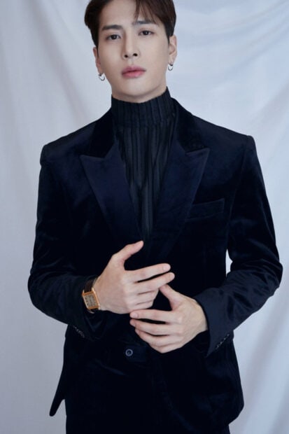A portrait of Jackson Wang wearing a black velvet suit and watch with a neutral background, HD Mobile Wallpaper