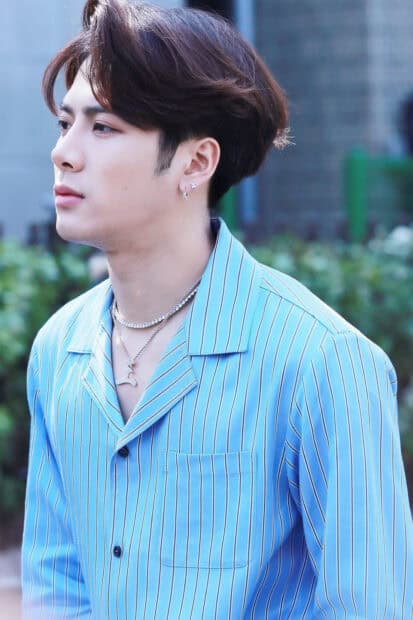 Jackson Wang looks thoughtful wearing a blue striped shirt and silver necklaces, HD Mobile Wallpaper