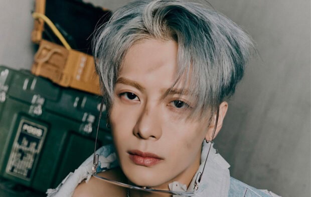 Jackson Wang showcases a thoughtful expression with silver hair and stylish accessories, HD Desktop Wallpaper