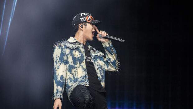 Jackson Wang is singing energetically during a live concert, HD Desktop Wallpaper