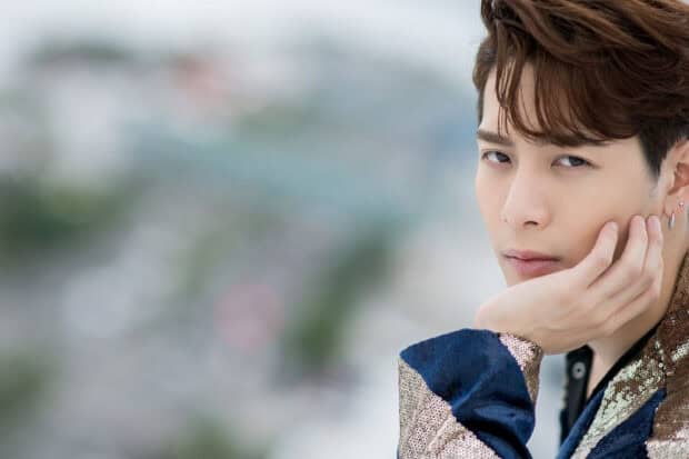A close up portrait of Jackson Wang wearing a sequined jacket with a thoughtful expression, HD Desktop Wallpaper