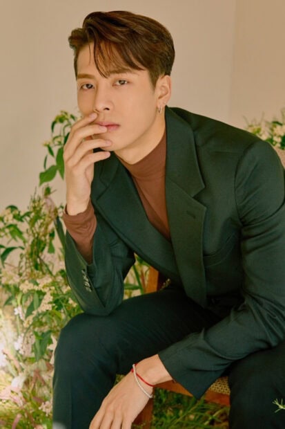 Jackson Wang wallpapers showing him sitting thoughtfully in a green suit jacket, HD Phone Wallpaper