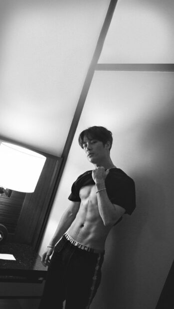 Jackson Wang is posing shirtless by the wall near a lamp, HD Phone Wallpaper