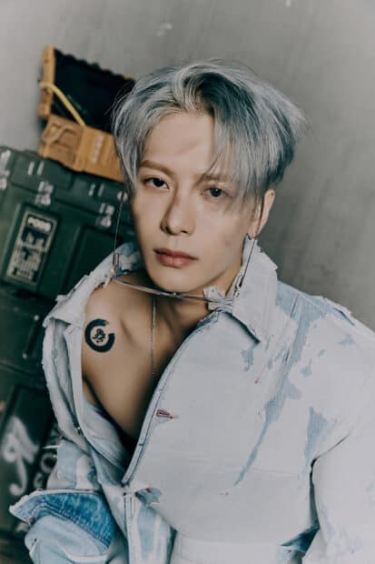 A close up portrait of Jackson Wang wearing a denim jacket and silver chain, 2K Mobile Wallpaper
