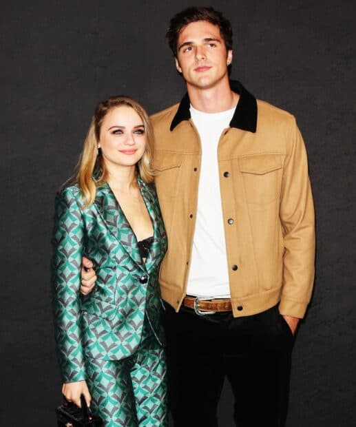 Jacob Elordi stands with a woman dressed in patterned suit at a formal event, HD Desktop Wallpaper