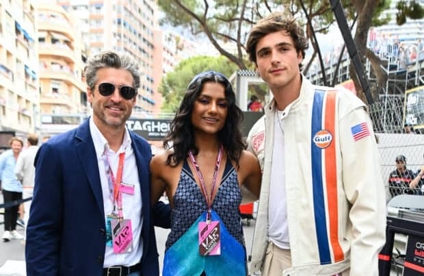 Jacob Elordi poses with two people at an outdoor racing venue, HD Desktop Wallpaper