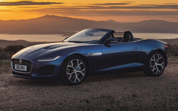 A blue Jaguar F Type sports car is parked on a mountain road during sunset, HD Desktop Wallpaper
