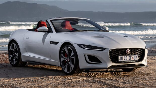 A white Jaguar F Type with red interior parked on sandy beach near waves, HD Desktop Wallpaper