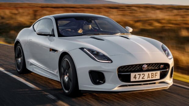 A white Jaguar F Type is driving fast on a scenic road during sunset, HD Desktop Wallpaper
