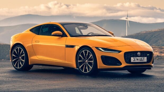 A bright yellow Jaguar F Type is parked with mountains in the background, HD Desktop Wallpaper