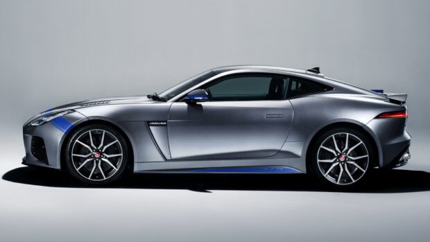 A sleek silver Jaguar F Type is displayed in profile with blue accents, HD Desktop Wallpaper