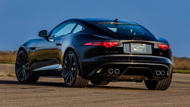 A black Jaguar F Type is parked on an open road under a clear blue sky, HD Desktop Wallpaper