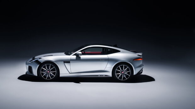 A silver Jaguar F Type is displayed from the side in a studio setting, Jaguar F Type Wallpapers, 2K Desktop Wallpaper