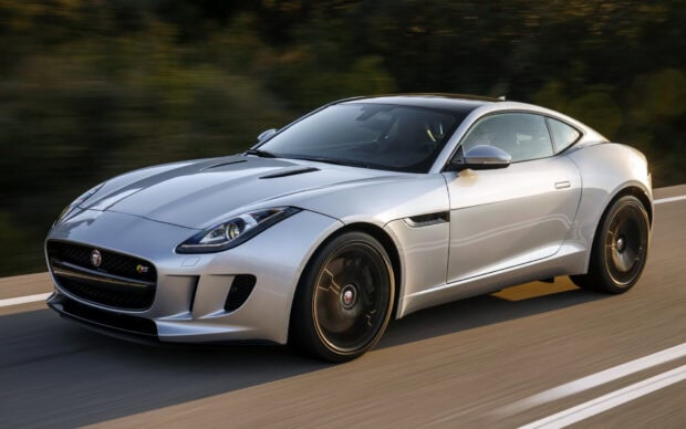 A silver Jaguar F Type is driving fast on a road with blurred trees in the background, HD Desktop Wallpaper