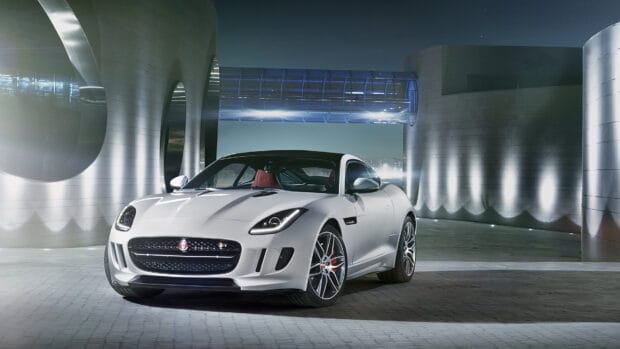 A white Jaguar F Type is parked in a modern urban area under blue lights, HD Desktop Wallpaper