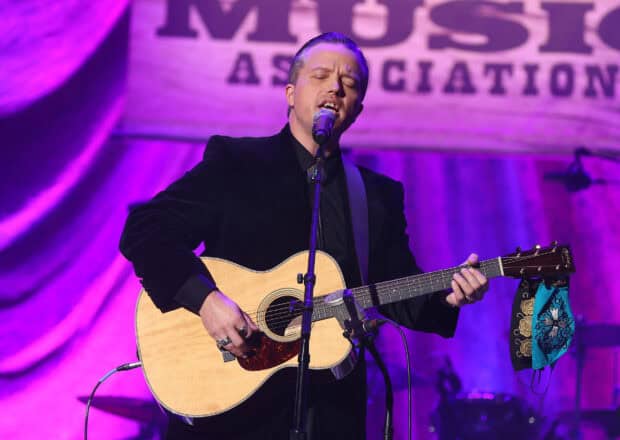 Jason Isbell passionately playing guitar and singing on stage during a concert, HD Desktop Wallpaper