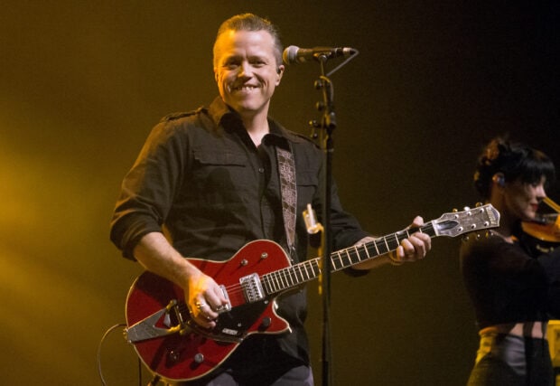 Jason Isbell is playing a red electric guitar during a concert, 2K Desktop Wallpaper