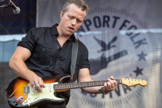 Jason Isbell playing an electric guitar on stage during a concert performance, 2K Desktop Wallpaper