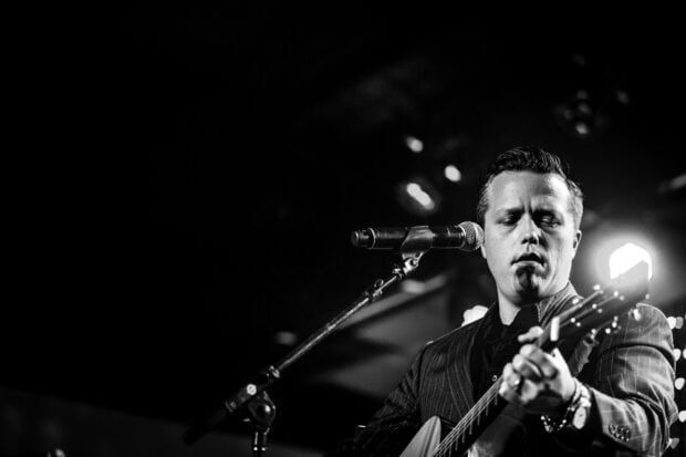 Jason Isbell performing with guitar on stage during concert, HD Desktop Wallpaper