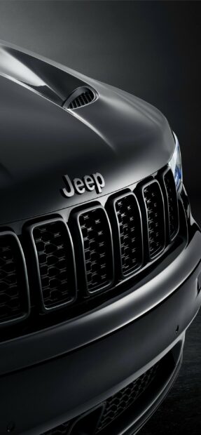 Close up of a Jeep Grand Cherokee front grill with sleek black finish, 2K Mobile Wallpaper