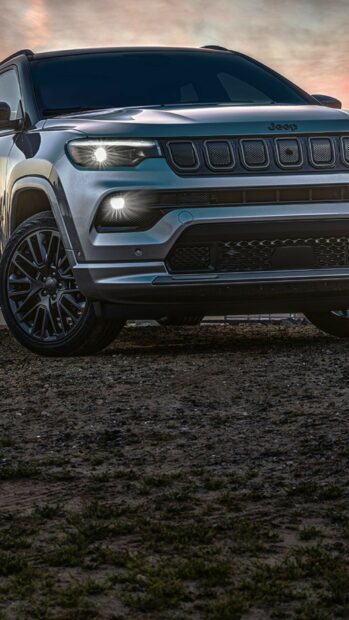 A close up of a Jeep Grand Cherokee with headlights on in an outdoor setting, HD Mobile Wallpaper