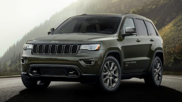 Jeep Grand Cherokee is parked on a mountain road with trees in the background, HD Desktop Wallpaper