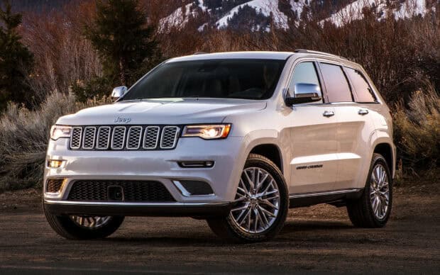 A white Jeep Grand Cherokee is parked on a dirt road with trees and mountains in the background, HD Desktop Wallpaper