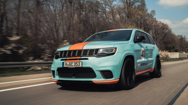 A blue Jeep Grand Cherokee with orange racing stripes drives fast on the highway, HD Desktop Wallpaper