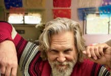 Jeffrey Bridges sits confidently wearing a red and striped cardigan with a playful expression, HD Mobile Wallpaper