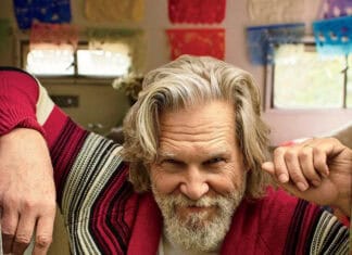 Jeffrey Bridges sits confidently wearing a red and striped cardigan with a playful expression, HD Mobile Wallpaper