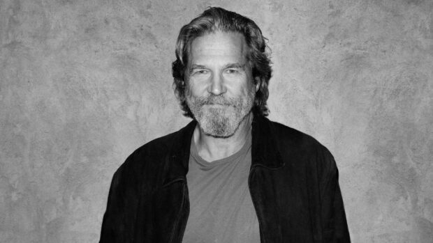 Jeffrey Bridges wallpapers features a smiling man with a beard and long hair in casual clothes, HD Desktop Wallpaper