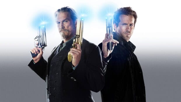 Jeffrey Bridges holds two glowing pistols standing back to back with a serious expression, HD Desktop Wallpaper