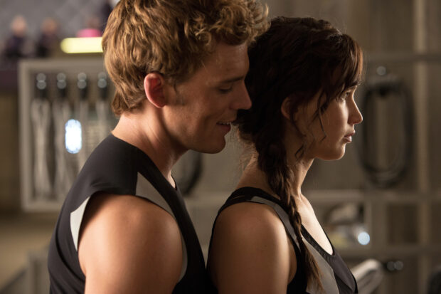Jennifer Lawrence and Sam Claflin in a scene from The Hunger Games, 2K Desktop Wallpaper