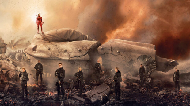 Jennifer Lawrence stands with other characters in a post apocalyptic setting from The Hunger Games, 4K Desktop Wallpaper