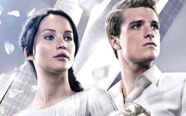 Jennifer Lawrence and a young man stand together with petals falling around them, 2K Desktop Wallpaper