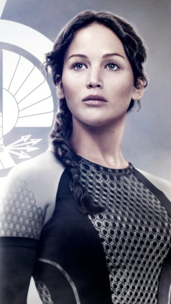 Jennifer Lawrence in a futuristic suit from The Hunger Games stands with determination, HD Phone Wallpaper
