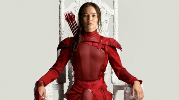 Jennifer Lawrence The Hunger Games Wallpapers shows her sitting on an ornate white throne in red armor, HD Desktop Wallpaper