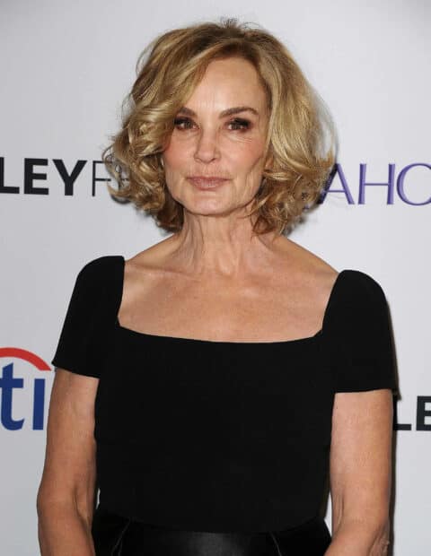 Jessica Lange wears a black dress posing at an event, 2K Desktop Wallpaper