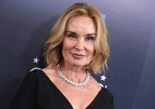 Jessica Lange poses with a confident smile wearing a silver necklace, HD Desktop Wallpaper
