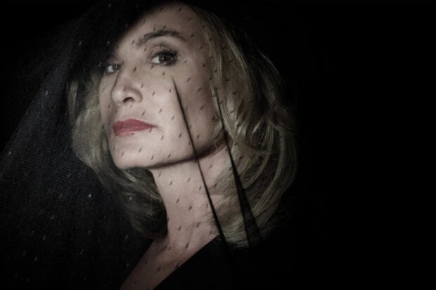 Jessica Lange is shown wearing a mesh veil against a dark background, HD Desktop Wallpaper