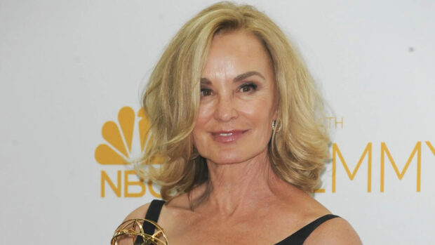 Jessica Lange holding an award and smiling at an event with NBC Emmy backdrop, HD Desktop Wallpaper